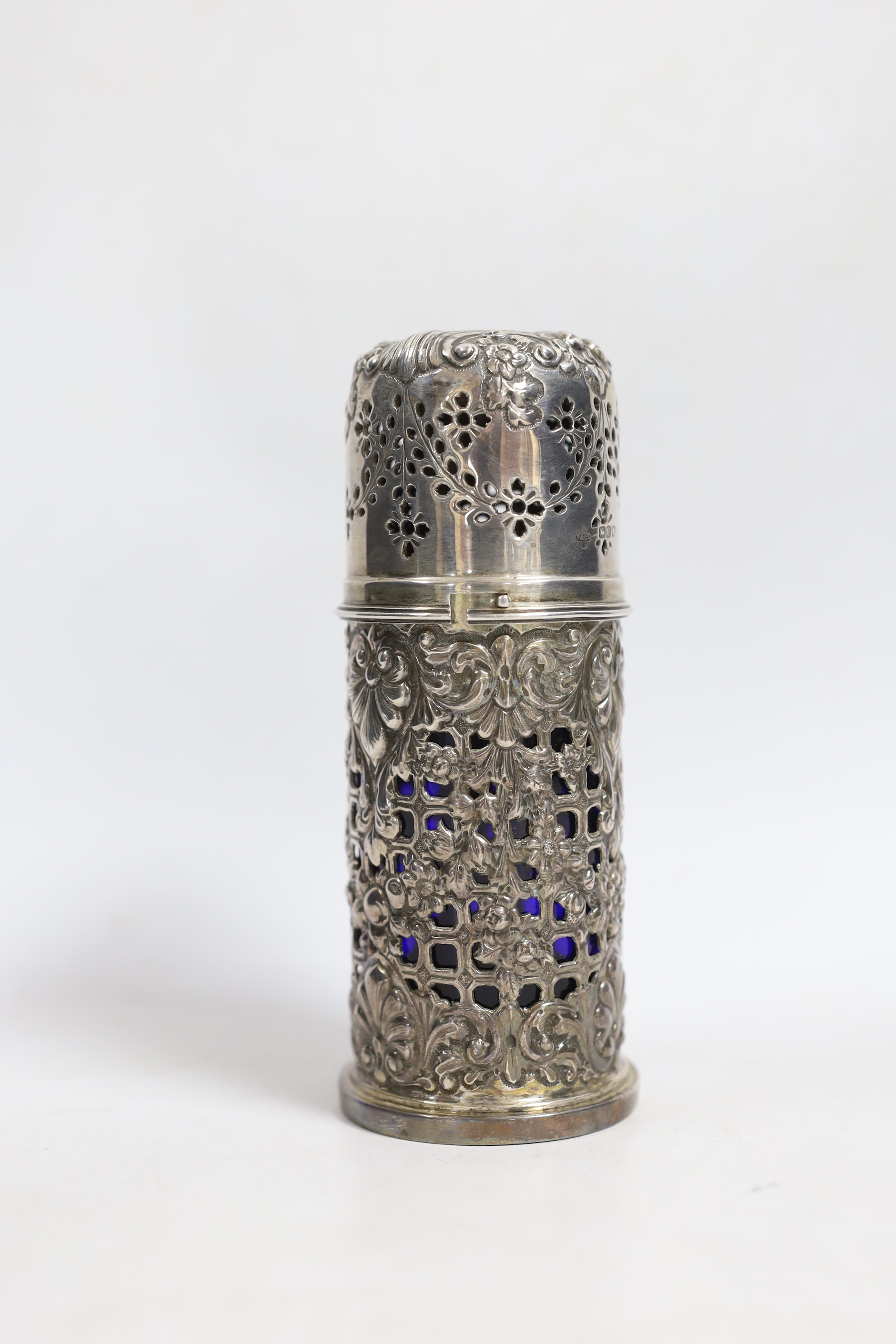 A late Victorian pierced silver lighthouse sugar caster, Horace Woodward & Co Ltd, London, 1898, with blue glass liner, 15.7cm.